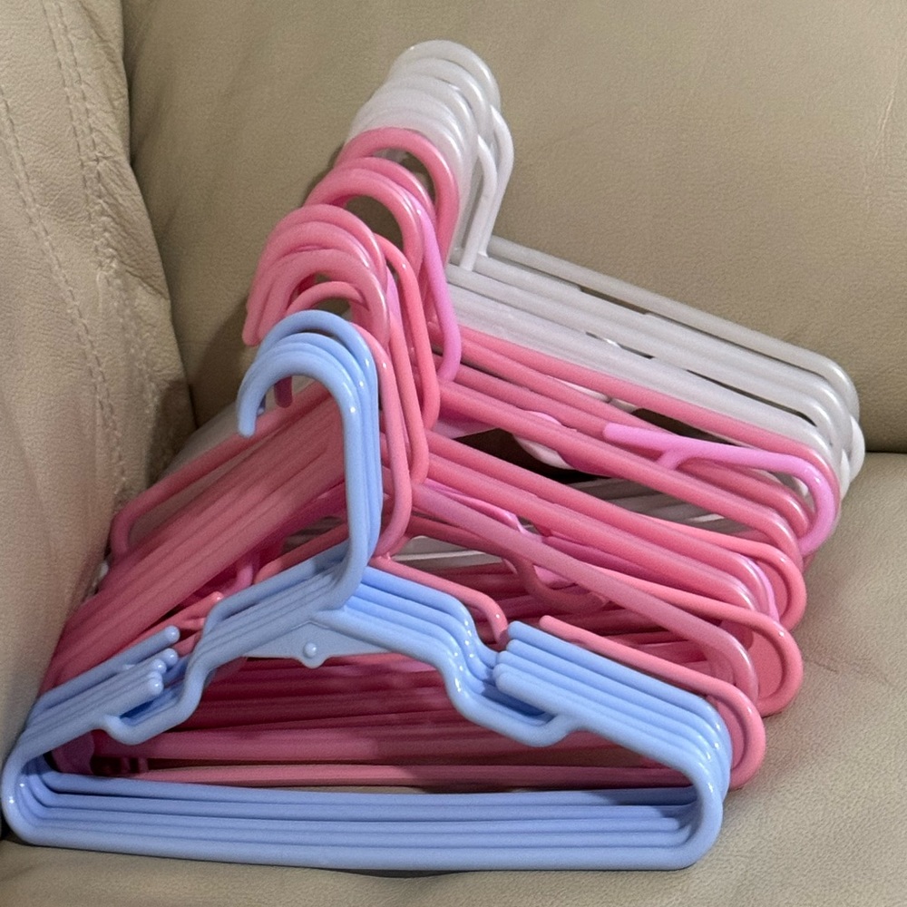 Lot of 39 multicolor (baby blue, pink, and white) children’s hangers